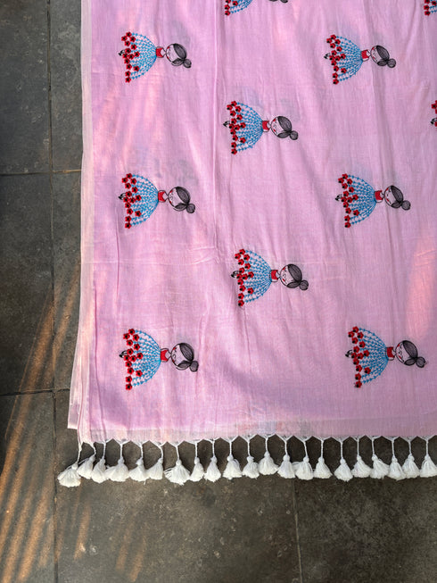 Pink mul saree with embroidered design of a girl in a blue dress by Taana Bana