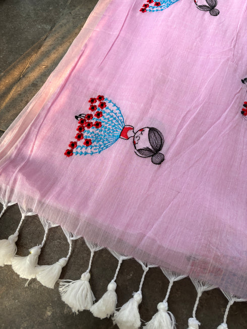 Pink mul saree with embroidered design of a girl in a blue dress by Taana Bana